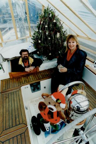 Deck the deck with Christman trimmings, advise Rusty Rafuse and Lisa Cooper, enjoying theirs.
