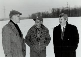Woodlot Stands: Celebrating the preservation of a Scarborough woodlot are MPP Ron Cousens (left), owner Russell Reesor, and Markham Councillor Ken Dunphy
