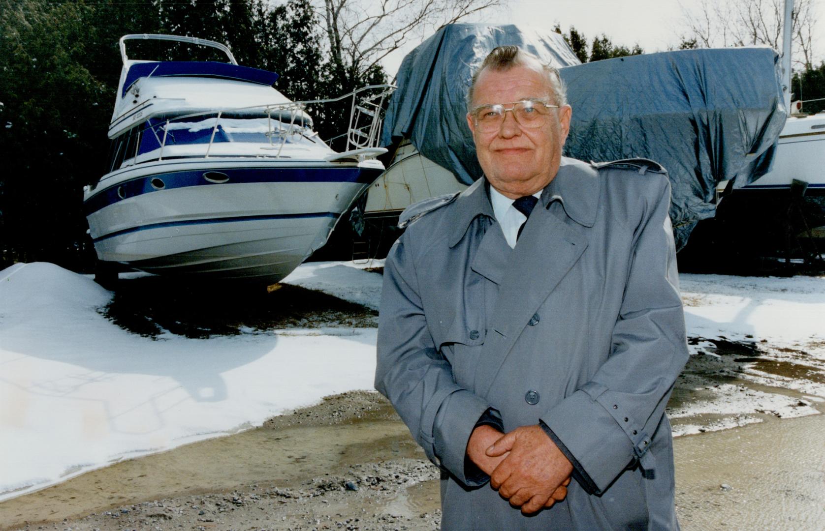 Sunken Dream: Stewart Reid repossesses an uncovered cruiser at a Keswick marina after the owner failed to make all the payments.