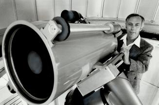 What a view: Astronomy professor Robert Roeder of Scarborough College gets ready to focus on the heavens with a 12-inch reflecting telescope.