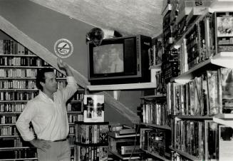 Cramped quarters, Ian Richardson of Video Networks watches Whatever Happened To Baby Jane? at his Church St