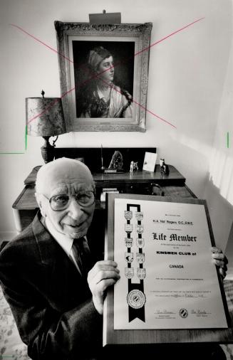 Founder: Hal Rogers, 90, founder of the Association of Kinsmen Clubs, holds his life member plaque. Rogers founded the service club in 1920.