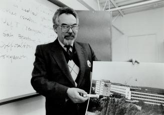 Norman Salansky points to picture of Soviet Academy of Sciences which has pioneered advances in medicine