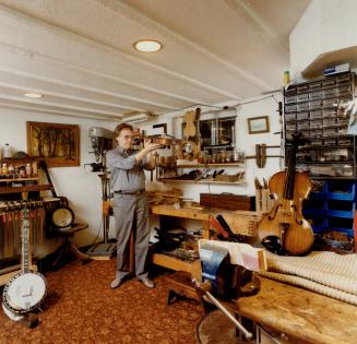 Converted apartment: Charlie Rose set up his workshop in a basement apartment, complete with carpets and piped in music