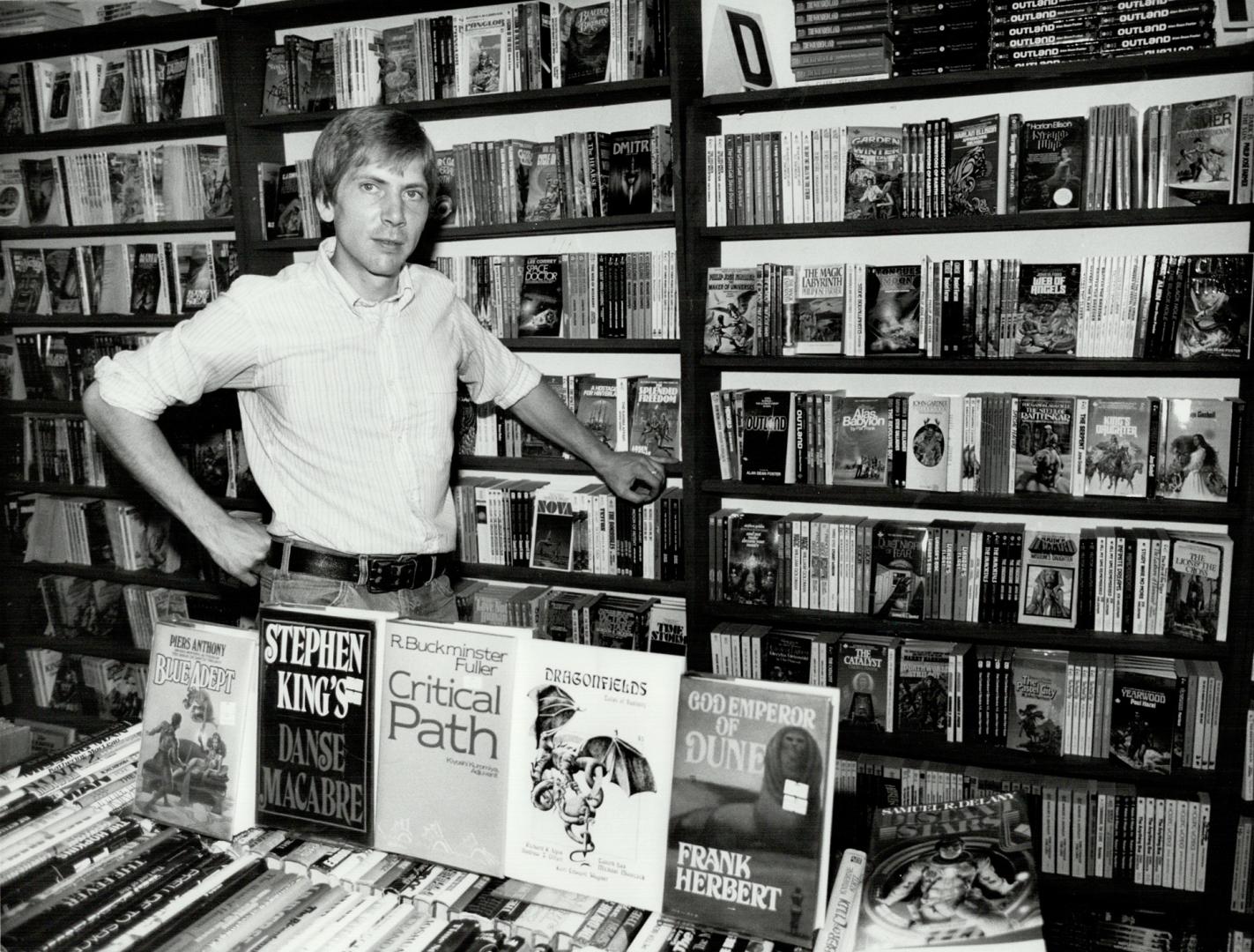 John Rose, who posts thumbnail reviews to warn his customers about books they may not like, with some of the thousands of science fiction works in his store of Queen St