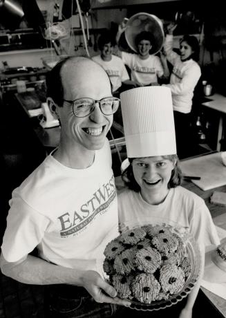 Tasty treat: Ron Rosenthal and baker Maria Marino offer East West restaurant's popular maple-almond cookies.