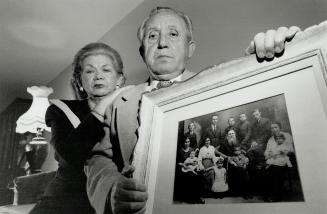 Aaron Rosenzweig, with wife Frieda, shows family picture