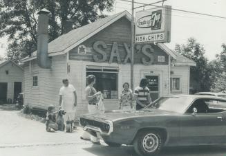 Stan Saxton, left in white, moved from Toronto to the small Lake Simcoe town of Keswick 23 years ago