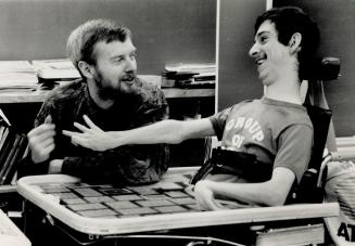 Real buddies: David Sheppard (left), who has multiple sclerosis, devotes much of his time teaching students such Chris, a resident at Bloorview Hospital with cerebral palsey