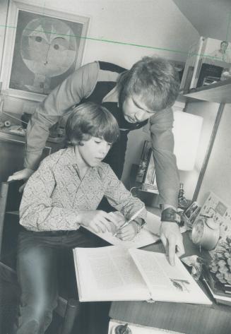 Don Snider tutors son bert, 12. Snider family follows more traditional family roles
