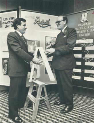 Neil Shaw, left, president of Redpath Industries Ltd