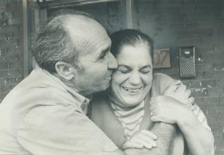 Reunited after three-year separation, George Sindihakis, 50, hugs wife, Demetra, 48