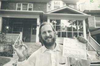 A Winner: Musician Harry Skura gives the OK sign after the assessment on his Glendale Ave