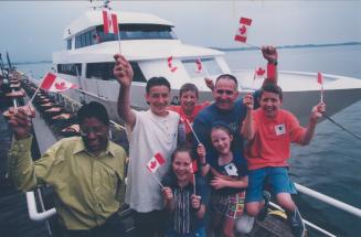 All aboard for camp: Tom Smith, Hemophilia Ontario's executive director, right, with some of the lucky kids who go to Camp Wanakita beside the Yankee Lady III