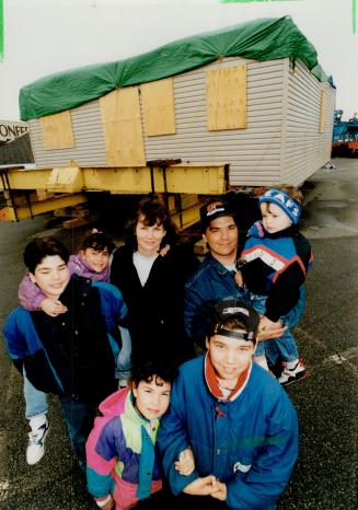 House move? Doug and Christine Sasaki and their five children - Keith, 13, Richard, 12, Ashley, 8, Elaine, 7 and Jacob, 3 - hope to find a place they can put their house, now temporarily stuck in a North York parking lot
