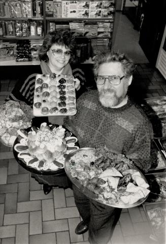 Deanna and Tom Schaffer, left, of Tastefully Yours served up kosher delicacies.
