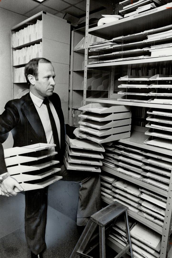Forms, forms, more forms: Kuehne and Nagel International's export and national project manager, Peter Schmidt, shows a sampling of the forms needed by companies that export
