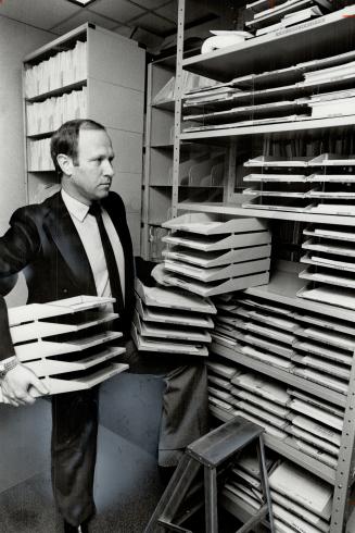 Forms, forms, more forms: Kuehne and Nagel International's export and national project manager, Peter Schmidt, shows a sampling of the forms needed by companies that export