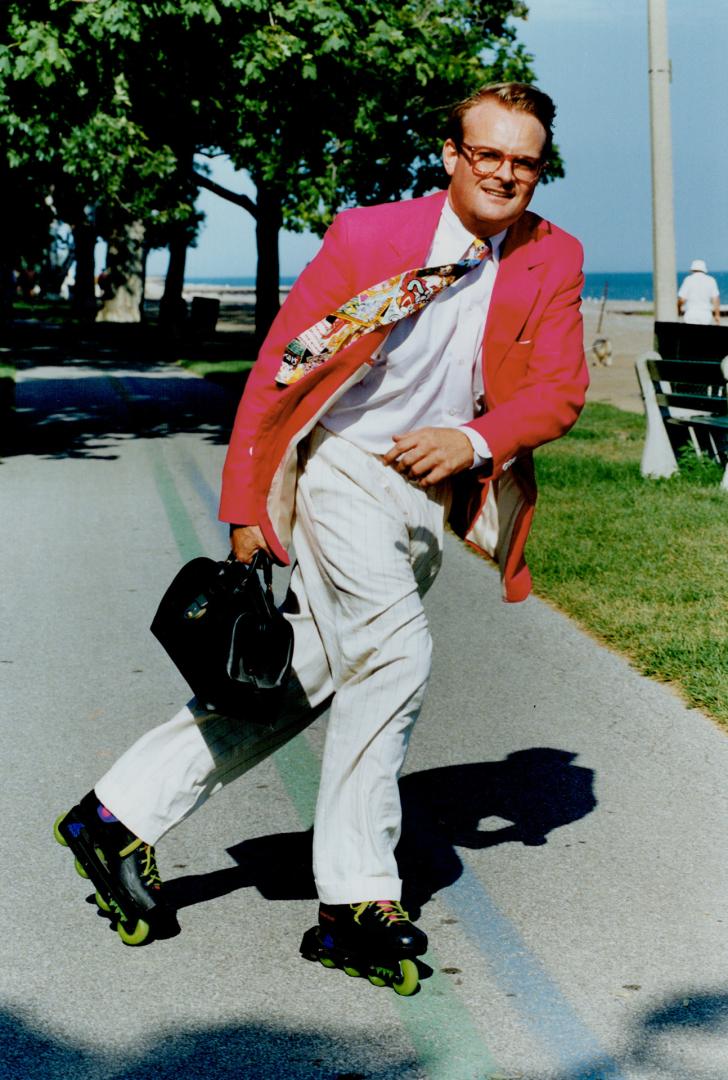 On a roll: Financial consultant Robert Dr. Bob Seitz wears hot pink linen blazer, cotton shirt, pin-striped trousers and Nicole Miller tie.