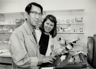 Learned volunteer: Retired U of T professor Stephen Sim, 70, shown with co-worker Pauline Santora, is very active as a volunteer in the pharmacy department at Grace Hospital in Scarborough, whre he plays a support role for 10 of his former students