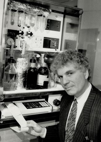 New frontiers: Dr. Michael Sole shows off a gene assembler machine at new cardiovascular research centre in Toronto General where 30 scientists will join forces.