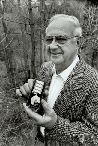 Morry Smith: Willowdale community activist holds the Canada 125 medal he and 14 other North York residents were awarded earlier this month.