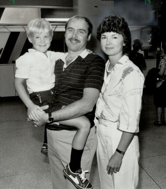 Happy reunion: Ron and Gabriele Smuk of Kitchener were happily reunited with their son, Jeffrey, 7, at Toronto International Airport yesterday.