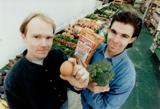 Organic Eggs-Perts: Stephen Sollie, left, and Ryan Penn show off wares at Vegetable Kingdom shop.