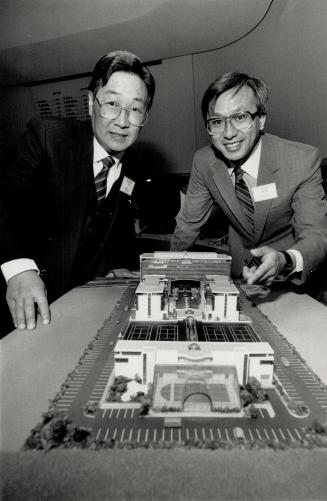 Building the future: Developer Joseph So, above left with designer Jick Chan, looks over the model of a $45 million corporate centre proposed for Scarborough