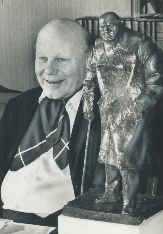Nephew of britain's wartime leader, John Spencer-Churchill, 68, sits beside a statue of Sir Winston Churchill