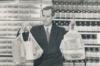 Making a difference: Loblaws president David Stewart holds up new string shopping bags the firm will sell