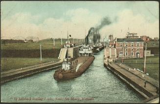 Two steamers leaving the locks. The first a whaleback, a cargo steamship with a hull that conti…