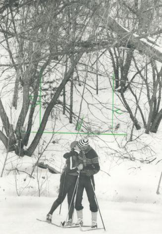Time out: Bernadette Hardaker and Rob Strang pause for a little romance while cross-country skiing yesterday at Mansfield Ski Resort north of Toronto, where no one complained about the snow