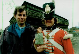 David Spittal, director of Fort York's archeology program, holds a cross-belt plate from the uniform of a regiment that fought in the battle for the fort in 1813
