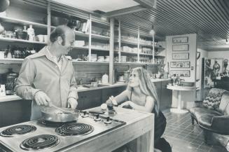 Host Bernie Taylor and guest Joanna Humen in cook's dream of a kitchen built into basement