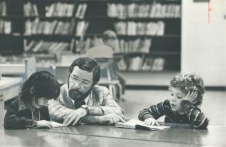 Just reading: Vice-principal William Turff chats with 2 of 21 youngsters who turned up yesterday at Forest Glen Public School during the first day of the strike by Peel Region's 2,600 striking elementary school teachers