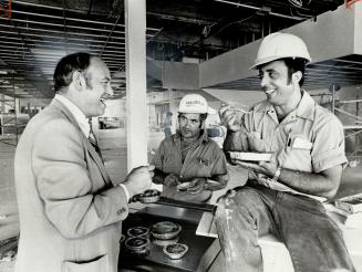 Advance sampling of pork pies is shared by John Spendlove, left, operations manager of P