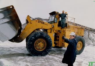 Just Dozin: National Slag president Ken Spencer isn't shy about singing the praises of his company's product: stag from the steel mills, stored in piles at Hamilton Harbor