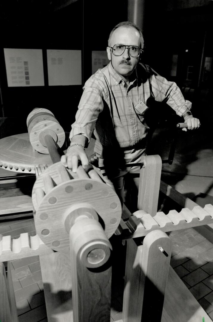 Science art: Science Centre information officer Brian Stein examines the toothed wheel and the pegged wheel in the exhibity, Leonardo da Vinci: Engineer and Architect