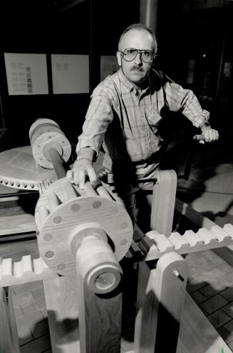 Science art: Science Centre information officer Brian Stein examines the toothed wheel and the pegged wheel in the exhibity, Leonardo da Vinci: Engineer and Architect