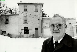 Wants demolition: Aurora Councillor Earl Stewart says tthe town's old police headquarters on Yonge St