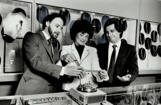 Famiily business: Eric Sutkiewicz, left, his sister Irit Shay and her husband, Michael Shay with the scale on which they weigh gold jewelry in their store, European Jewellery