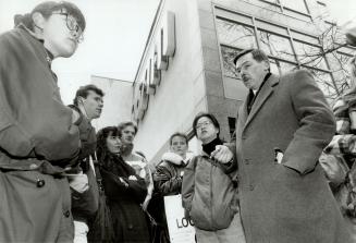 On the line: Northern Secondary School economics students gather outside Pizza Pizza headquarters on Jarvis St