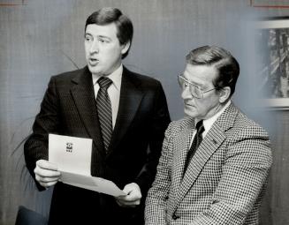 Allan Symons, left, and father, Gordon, head new insurance firm.
