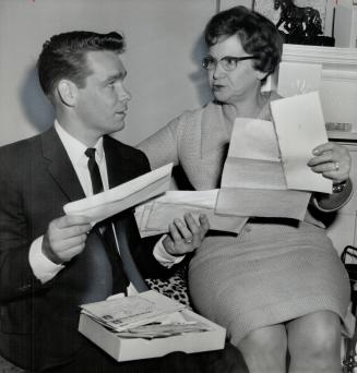 Murray Tait and Mrs. William Tait. Looking over letters of support from across Canada