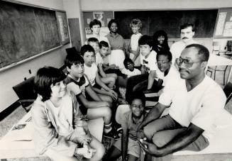 Class of '87: Dr. Hilroy Thomas, right, is opening private schools in Scarborough and Etobicoke to help students, labled under-achievers, make the grade. He says individual attention and small classes can raise a student's grade by one year. These students are catching up this summer.