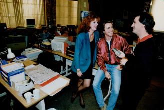 Mark Terry, right, interviews Sara Borsford and Mark Humphrey on the set of CTV's drama series, E