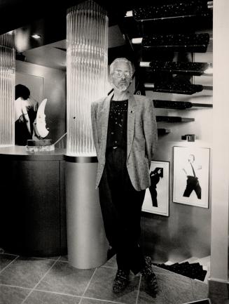 Charity Tour: Frank Thibodeau stands beside an acrylic column in one of the houses on a tour to raise money for the People With AIDS (P