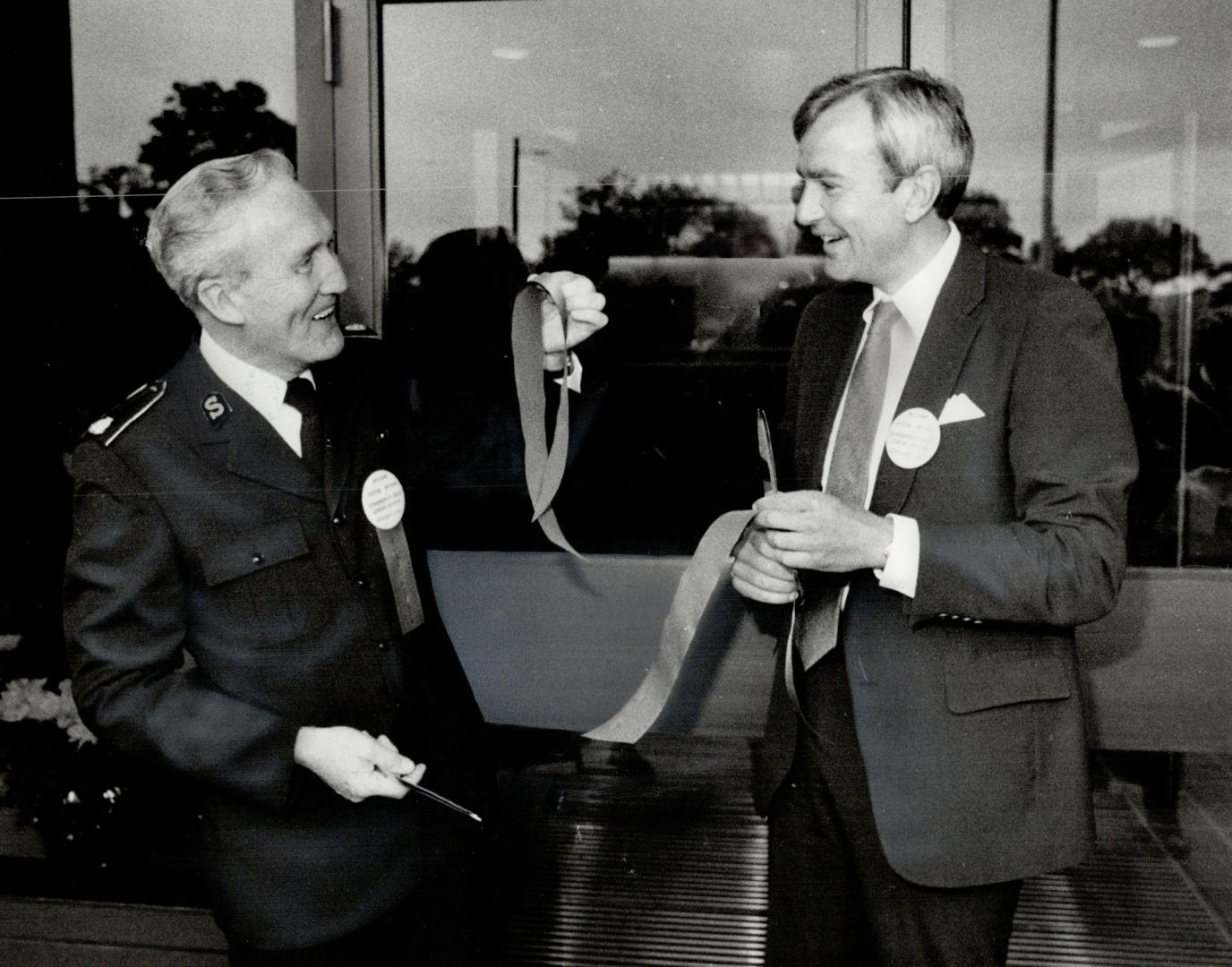 Ribbon cutting: Premier David Peterson, right, and Major Harold Thornhill, executive director of the hospital, beam as they open the Salvation Army's 10th Canadian hospital