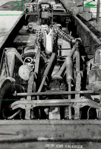 Wrecked business: They just put the torch to it and cut it into pieces, says Ted Turner, as he examines the remains of his $100,000 truck and equipment used in his sandblasting and cleaning business
